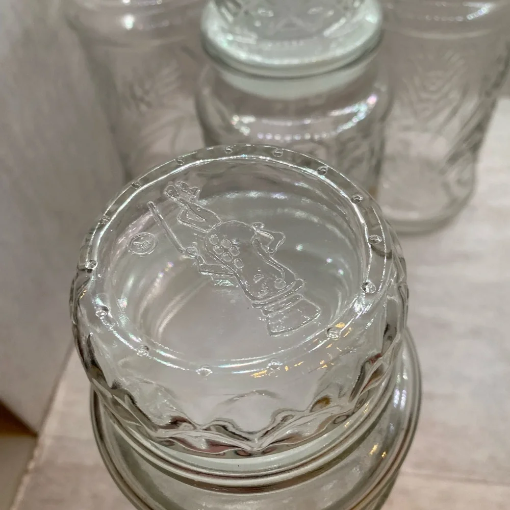 4 VINTAGE PLANTERS MR PEANUT GLASS JARS WITH LIDS (2) 1982, 1983, 1984